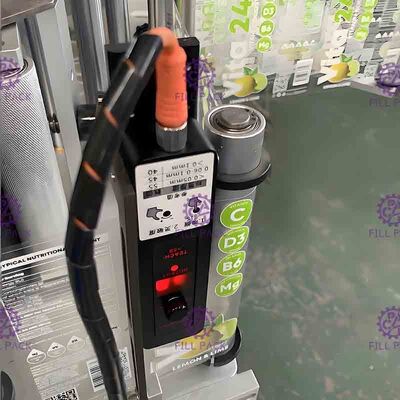 Ποτό που επεξεργάζεται τη χειρωνακτική μηχανή μαρκαρίσματος μπουκαλιών για τα μπουκάλια, που συρρικνώνονται τη σήραγγα